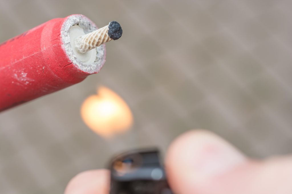 lighting a firecracker