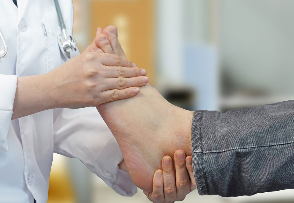 Doctor examining patient's foot