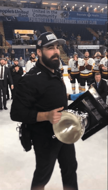 IBJI's Austin Kasper, ATC, celebrates the Chicago Wolves team win