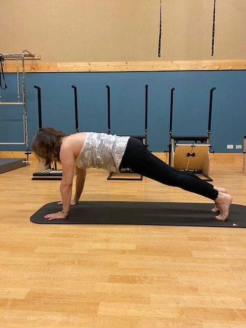 Debbie B performing pilates pose