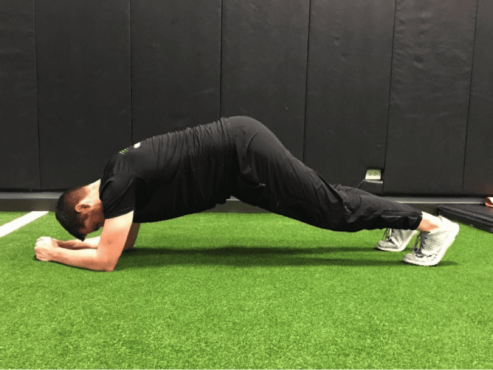 a man doing a plank incorrectly with his butt in the air