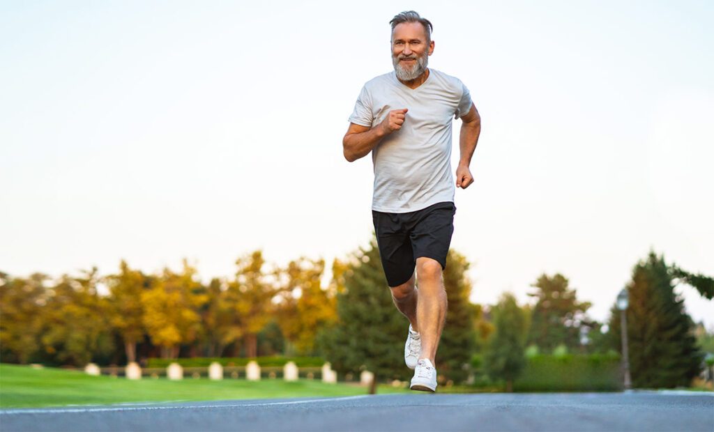 Older man avoiding runner's knee while jogging