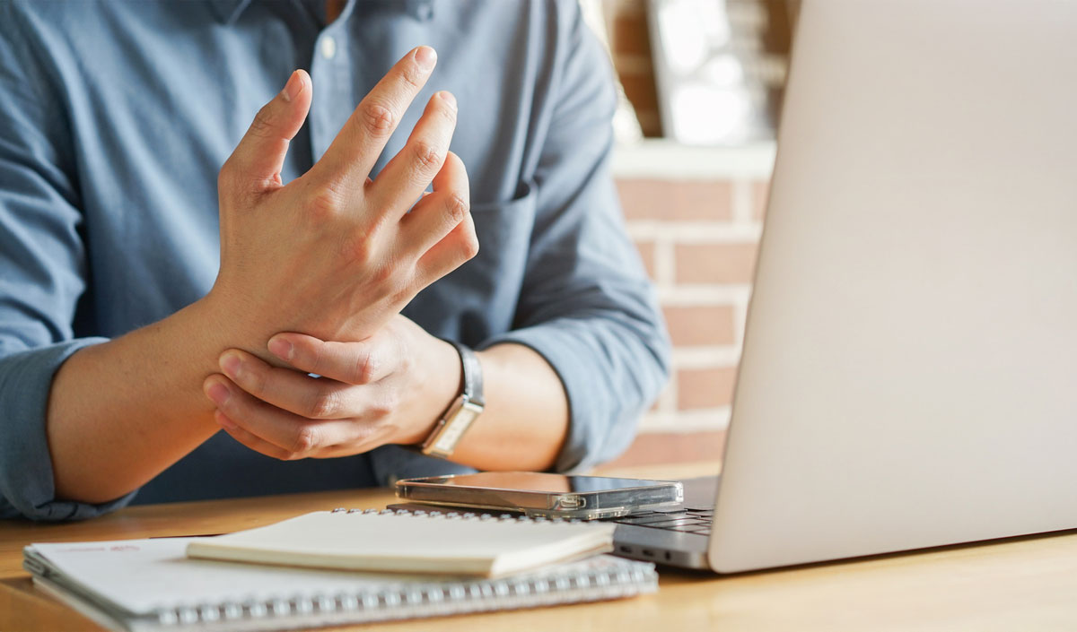 Man holding his wrist in pain