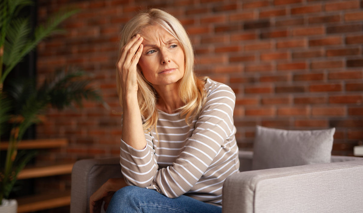 Woman experiencing a migraine