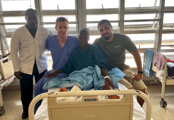 IBJI's Dr. Jasonowicz, Dr. Mulbah and Shady with a patient from their medical mission trip to Liberia