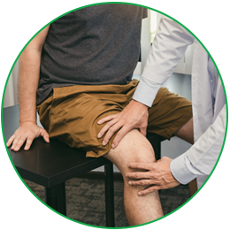 Doctor examining patient's knee