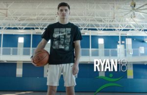Ryan holding basketball in gym