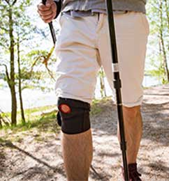 Man walking with knee brace